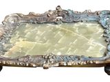 a silver tray with a mirror on top of it