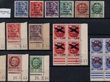 several different types of stamps are on display on a black surface