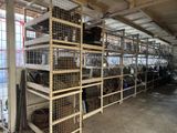 a large room with a lot of cages on the shelves
