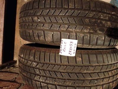two tires are stacked on top of each other on the ground