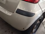 a white car that is parked in a garage