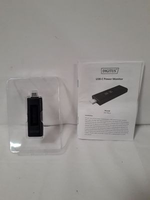 une image représentant une boîte contenant un appareil noir