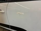 a close up of a car door with a sticker on it