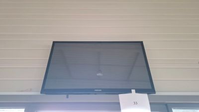 a picture of a flat screen tv mounted above a window