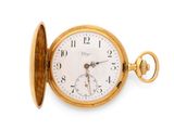 an old gold pocket watch on a white background with a white background