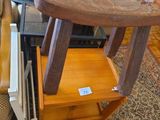 a small table with a wooden stool on top of it