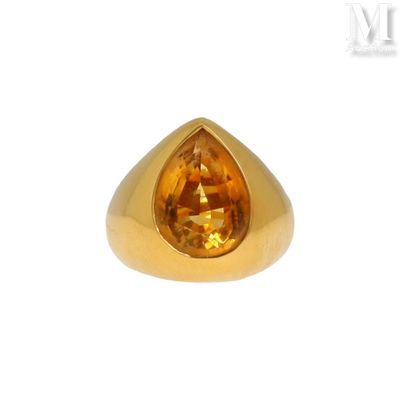 an image of a gold ring with a faceted citrine stone