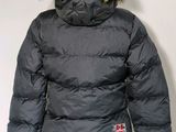 the back of a black jacket with a fur hood on a mannequin mannequin mannequin mannequin mannequin mannequin manne