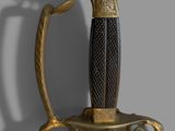 an image of a gold and black sword with a woman ' s head on it