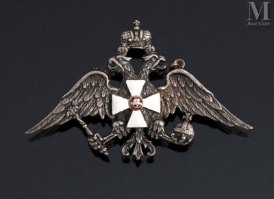 a close up of a metal badge with a cross on it