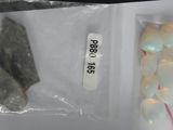 some rocks and other items in a bag on a table