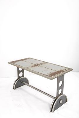 an image of a bench made out of a piece of metal