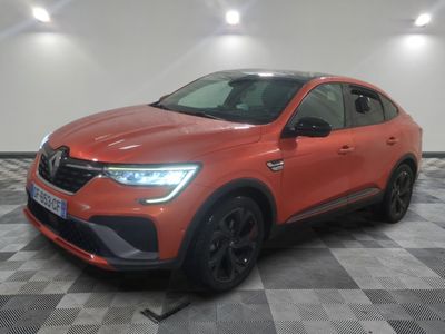 a red car parked in a room with a checkered floor
