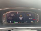the dashboard of a car with a digital display on it