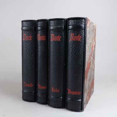 three black books sitting on top of each other on a white surface