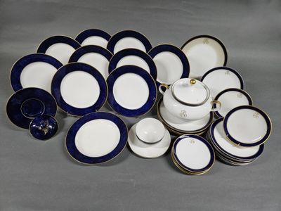 a pile of blue and white plates and bowls