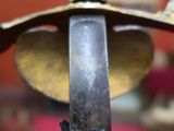 a close up of a sword on display in a museum