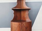 an image of a corner cabinet in a room