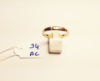 a close up of a gold ring with a price tag attached to it