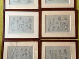 quatre dessins encadrés représentant des personnes et un chien sur un mur vert