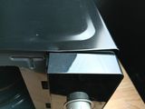 a close up of a microwave on a wooden table