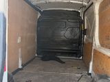 a white van that is parked inside of a building
