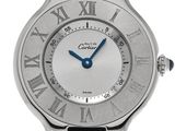 a close up of a silver wrist watch with roman numerals