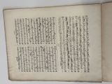 an open book with chinese writing on it sitting on a table