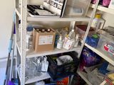 a small room with a shelf and a chair in it