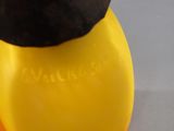 a banana and a banana peeler sitting next to each other
