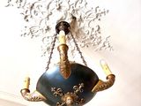 a chandelier hanging from the ceiling in a room