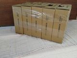 boxes are stacked on top of each other on a bed