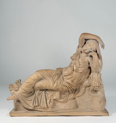 marble statue of a reclining woman reclining on a rock