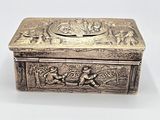 an antique silver box with an image of a man and a woman on it