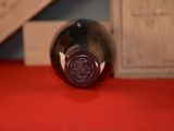 a bottle of wine that is sitting on a table