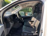 a white truck with black seats in the back of it