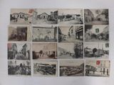 several old black and white photographs of people and buildings on a wall