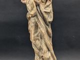 an image of a statue of a woman holding a child