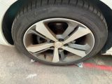 a close up of a tire on a car ' s rim