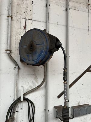 a wall with a bunch of tools hanging on it