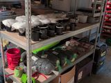 a shelf with pots and pans on it in a room