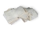 a pile of folded white napkins on a white surface
