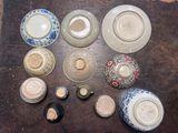 many different types of vases and bowls on the table