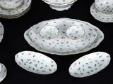 many different types of china on a black table