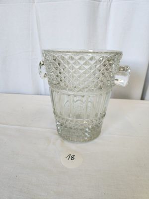 a glass vase that is sitting on a table