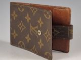 louis vuittou wallet with a brown leather case and a brown leather strap