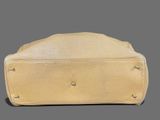beige leather purse with rivets and rivets on the front