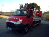 a red truck with a crane on the back of it