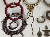 a lot of jewelry that is laying out on the table