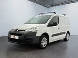 the white van is parked in a large room with a roof rack